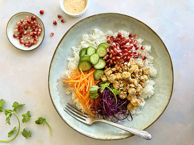 CRISPY TOFU BOWL WITH VEGETABLES AND POMEGRANATES